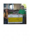 cattle sale Laurie Argue and Maura with cheque